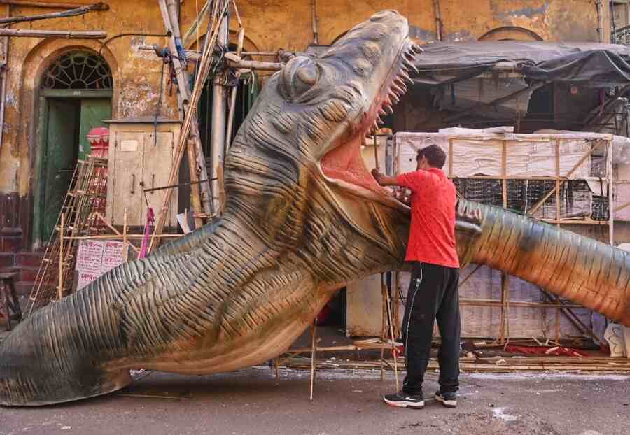 An artisan works on different characters at Dompara in Kumartuli on Saturday for the Kolkata International Children’s Film Festival. The event will be held from January 22