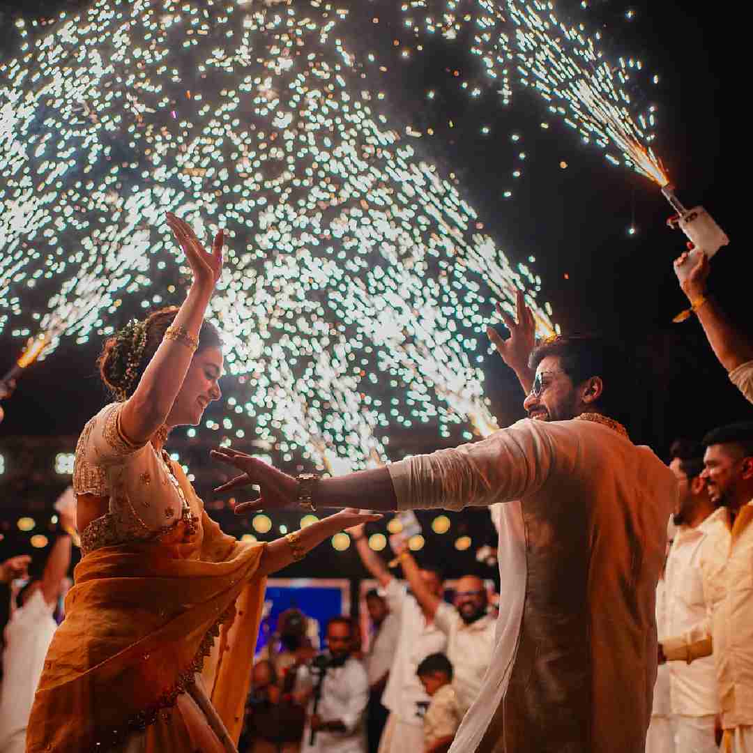 Keerthy and Antony let their hair down on the dance floor. A dazzling display of fireworks made for a picturesque background.  