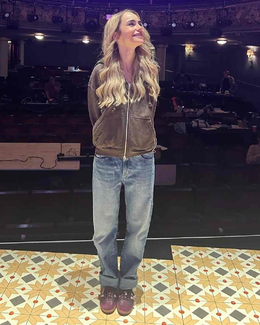 Clad in a jacket and jeans, Collins beamed with joy ahead of her performance. Written by Bess Wohl and directed by Lynette Linton, the play ran at London's Duke of York's Theatre. 
