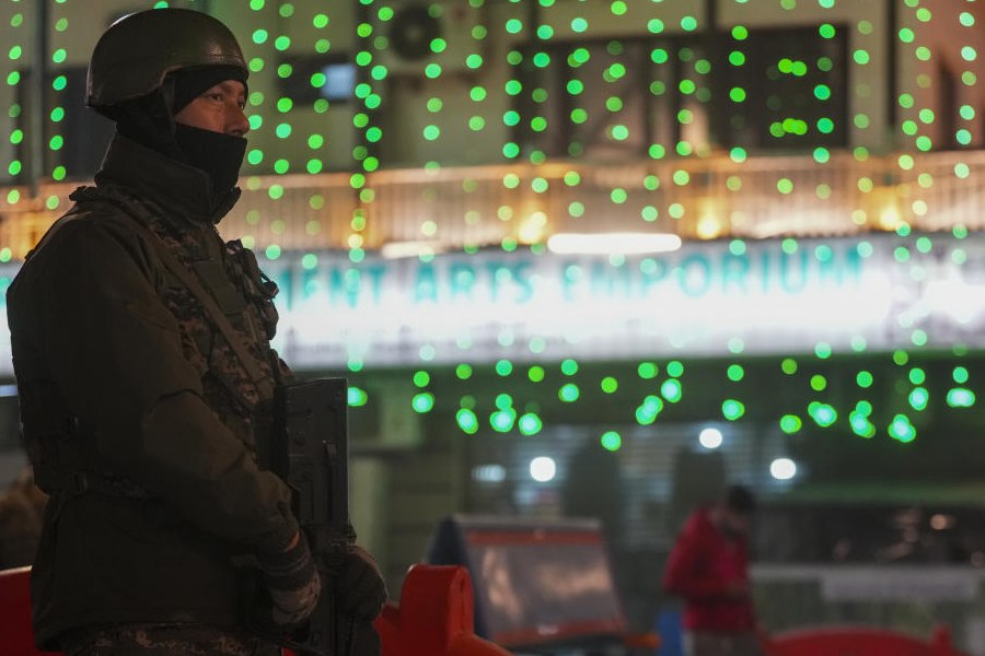 A security personnel stands guard at Lal Chowk on the eve of Republic Day, in Srinagar, Saturday, Jan. 25, 2025. Security has been beefed up across the Kashmir valley ahead of Republic Day.