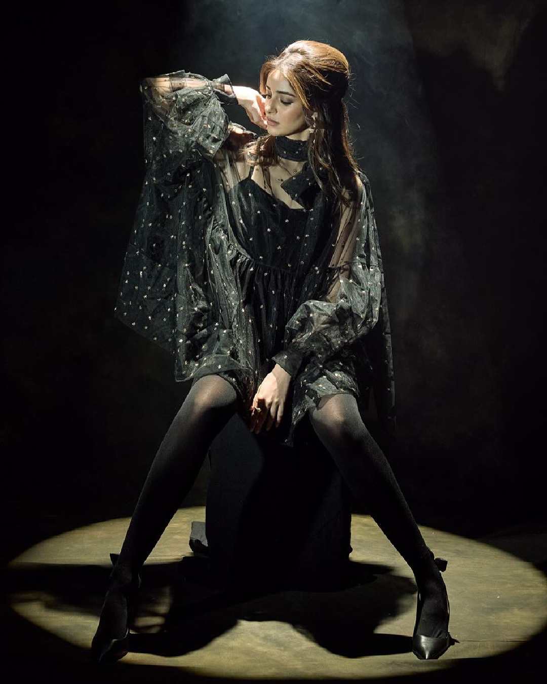 Ananya Panday styled a black baggy tunic with matching stockings and stiletto pumps. Hair loosely clutched at the back and dewy makeup enhanced the actress’s glamour quotient.  