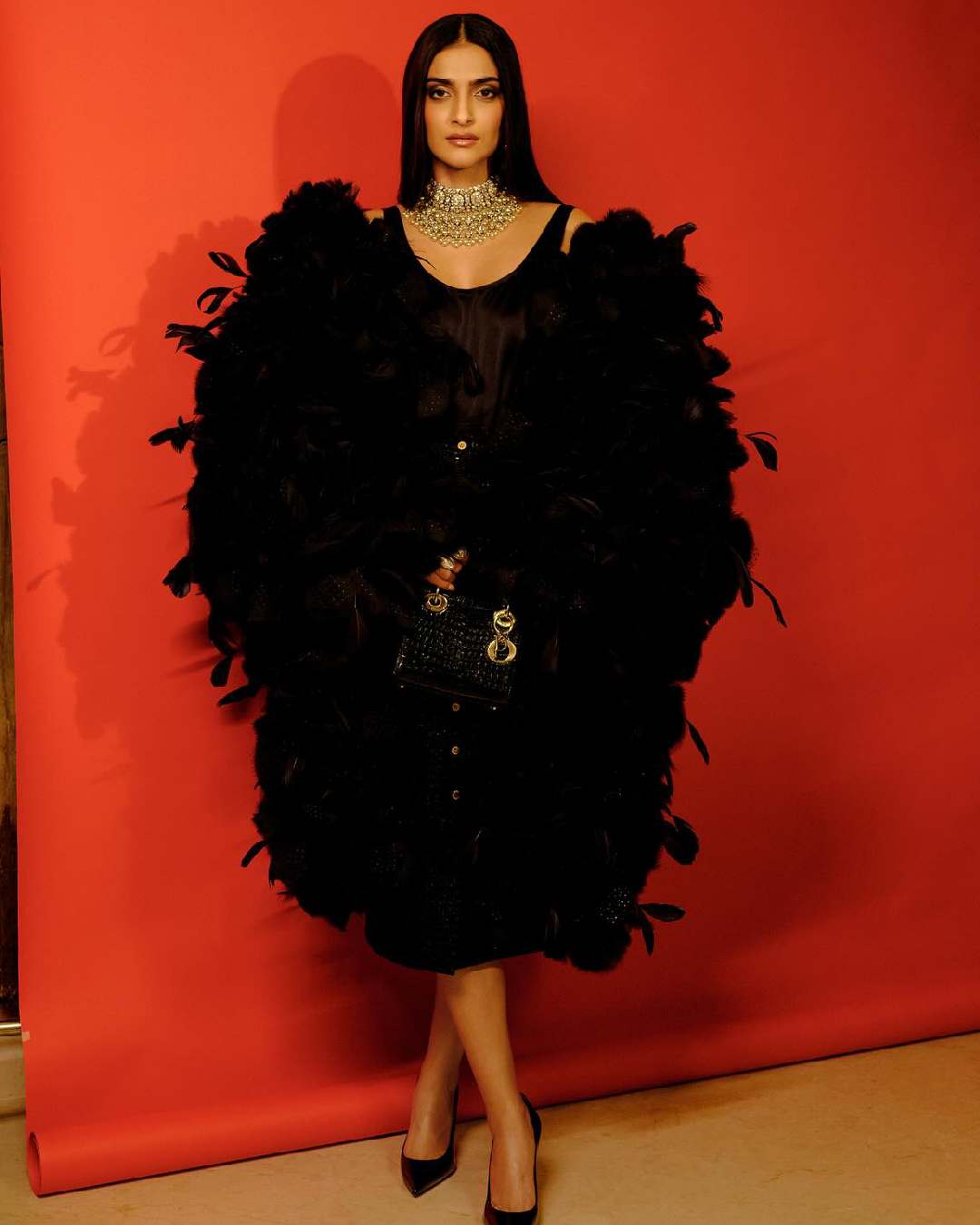 Sonam Kapoor also joined the actresses in black. She paired a black dress with a voluminous cape featuring black plumes. Sleek, straight hair, smokey eyes and stiletto pumps complemented her look..  