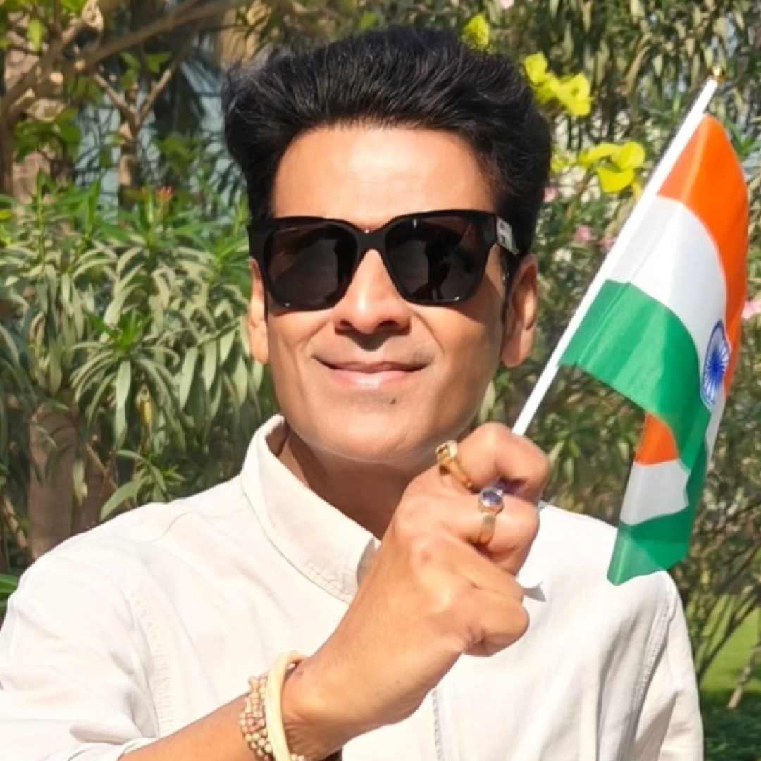 Manoj Bajpayee looked dapper in a white kurta and black shades as he waved a mini national flag.