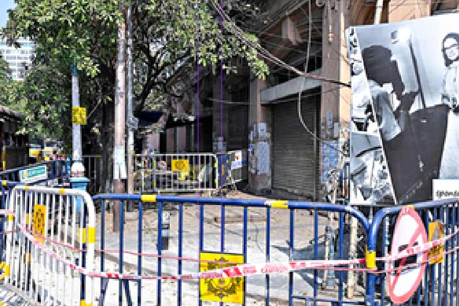 The cordoned-off portion of the footpath outside Esplanade Mansions on Monday.