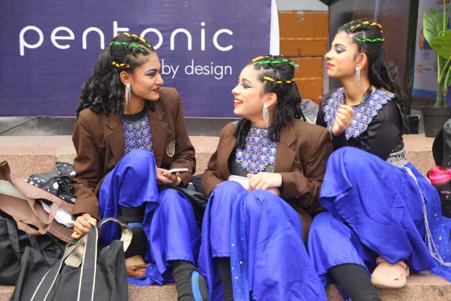 (From left) Heathvi Karmakar of Class IX and Srija Biswas and Ritisha Ghosh of Class VIII from Julien Day School, Ganganagar, have fun backstage.