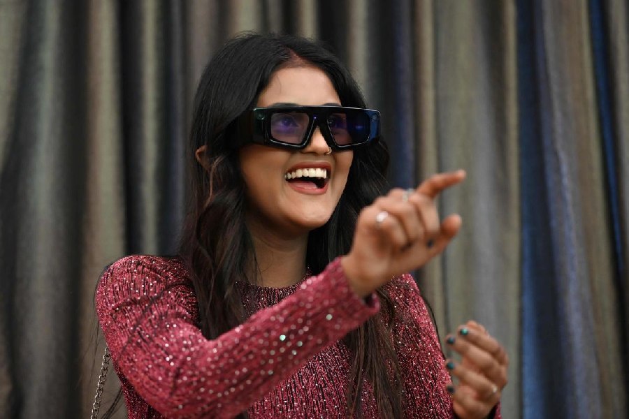 A participant tries on the alternate reality eye gear at Snapchat Creator Connect