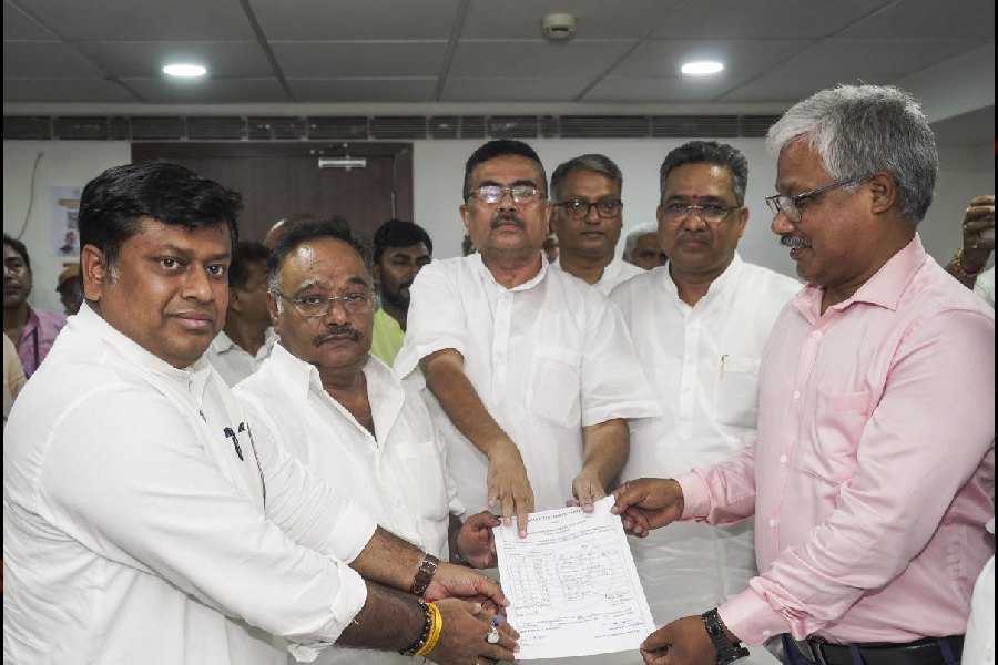 Rajya Sabha member Samik Bhattacharya (second from left) files his nomination for the post of Bengal BJP president in the presence of the outgoing state BJP chief Sukanta Majumdar (left) and leader of the Opposition Suvendu Adhikari (third from left)