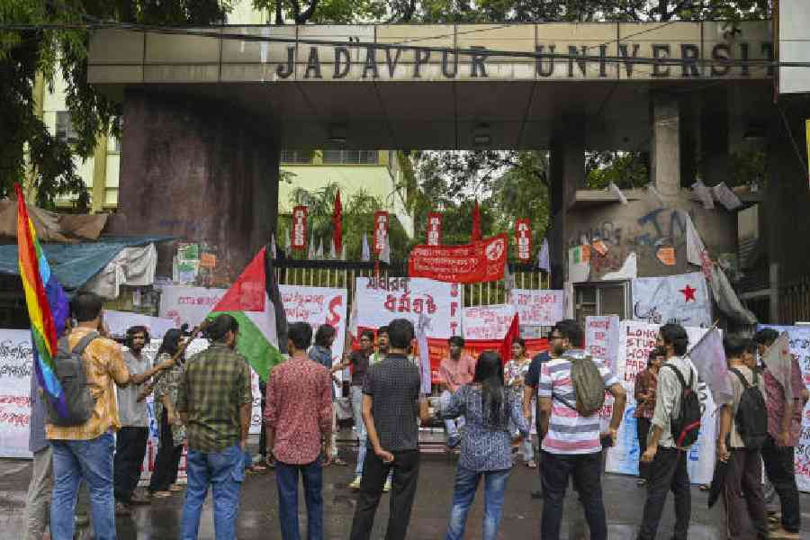 Members of various left wing student unions block the main entrance of Jadavpur University during a 24-hour nationwide general strike called by trade unions to protest against the central government's alleged anti-labour policies, in Kolkata