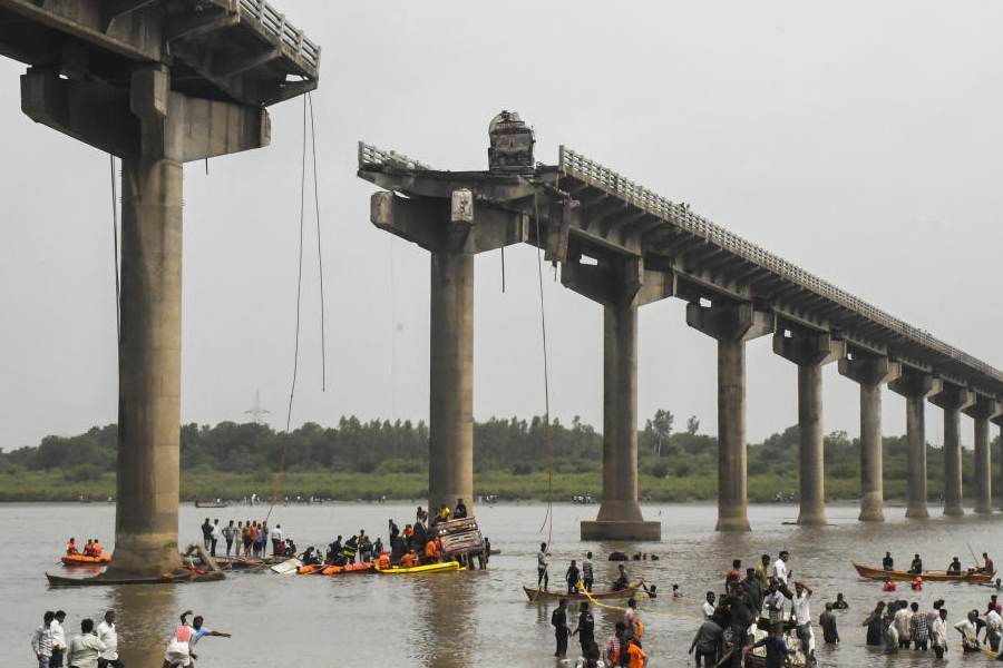 Rescue operation underway after several vehicles fell into the Mahisagar river when a portion of a four-decade-old bridge collapsed, in Gujarat's Vadodara district, Wednesday, July 9, 2025.