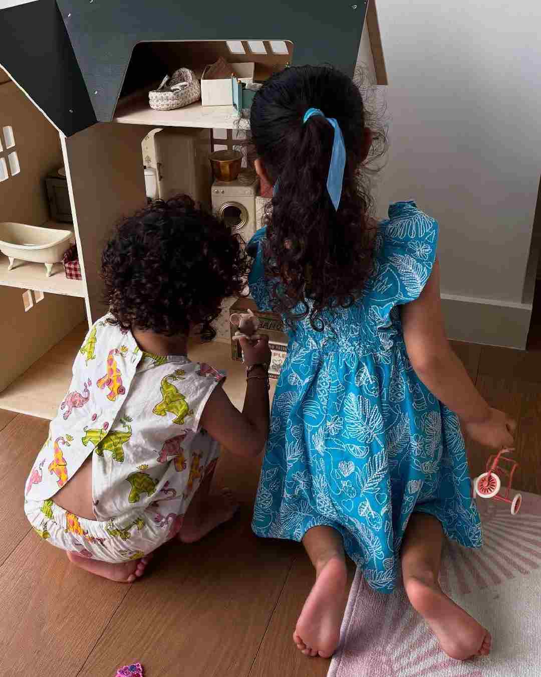 One of the photos shows Malti bonding with her little playmate.  