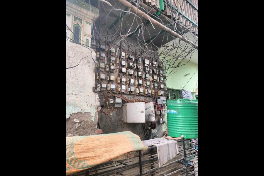 Electricity meters on the wall of a mosque in the Jai Hind Camp