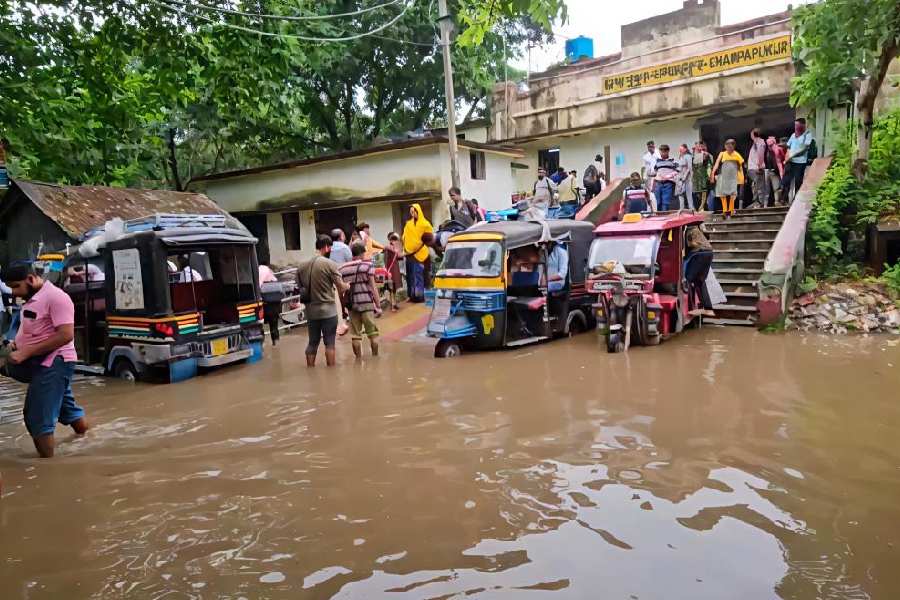 A waterlogged approach road near the Chapapukur railway station