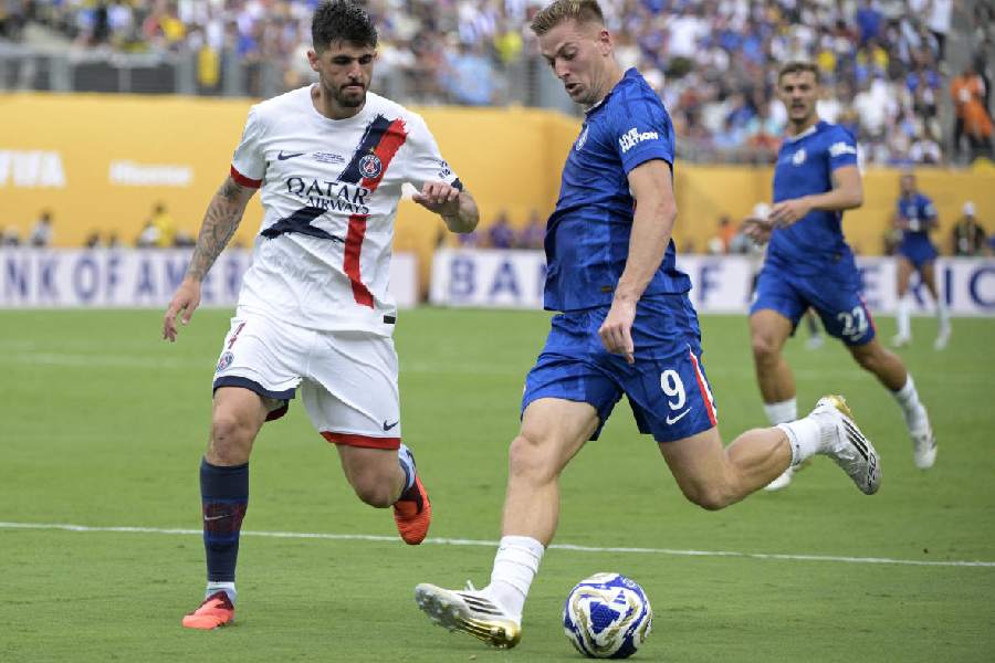 Chelsea's Liam Delap in action with Paris St Germain's Lucas Beraldo