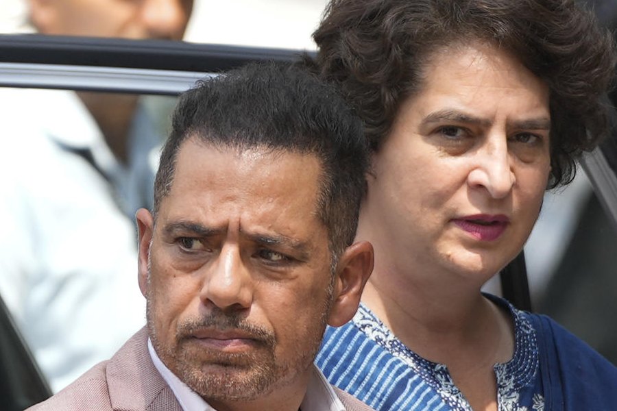 Businessman Robert Vadra with wife and Congress MP Priyanka Gandhi Vadra arrives at the Enforcement Directorate's office on the third straight day for questioning in a money laundering case linked to alleged irregularities in a 2008 Haryana land deal case, in New Delhi, Thursday, April 17, 2025.