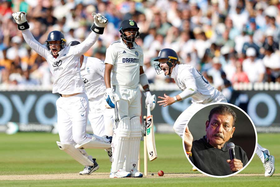 England's Jamie Smith and Ollie Pope celebrate after Shoaib Bashir takes the last wicket of India's Mohammed Siraj to win the test.