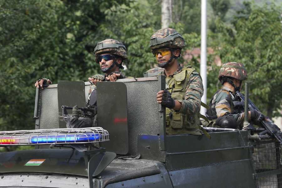 Security personnel conduct a cordon-and-search operation near Dachigam in Srinagar district on Monday.
