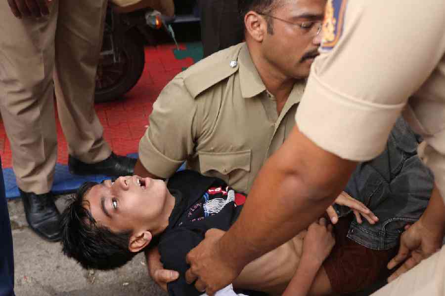A boy lies unconscious following a stampede outside a cricket stadium in Bengaluru, India, June 4, 2025.