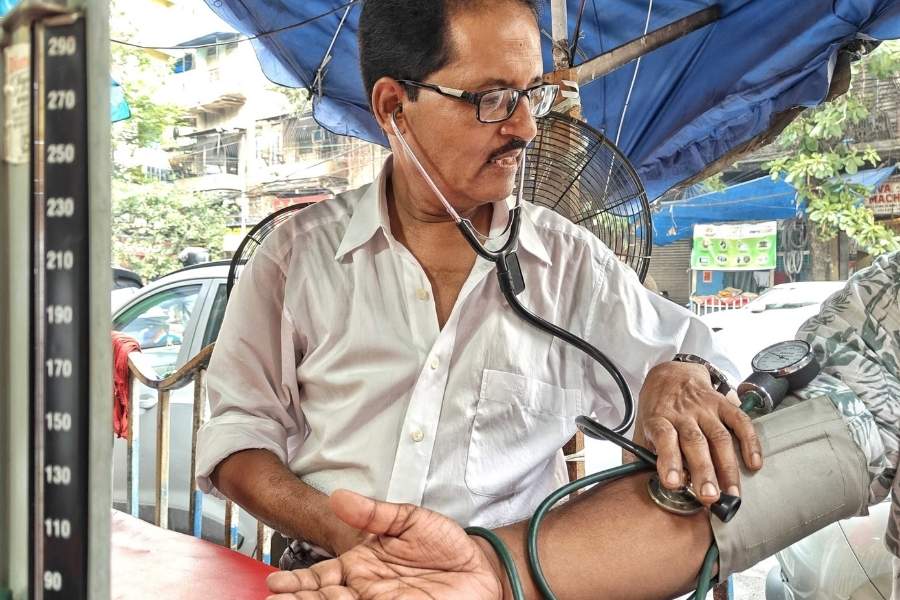 Das checks a man’s blood pressure
