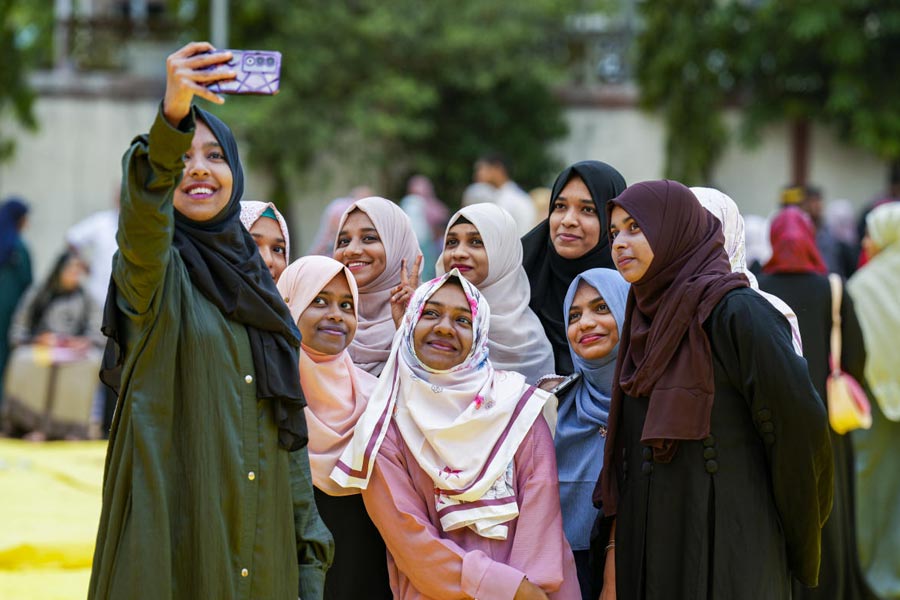 Young women pose for a selfie after offering ‘namaz’ on the occasion of ‘Eid-ul-Azha’ festival, at St. John's school campus, in Chennai, Tamil Nadu.