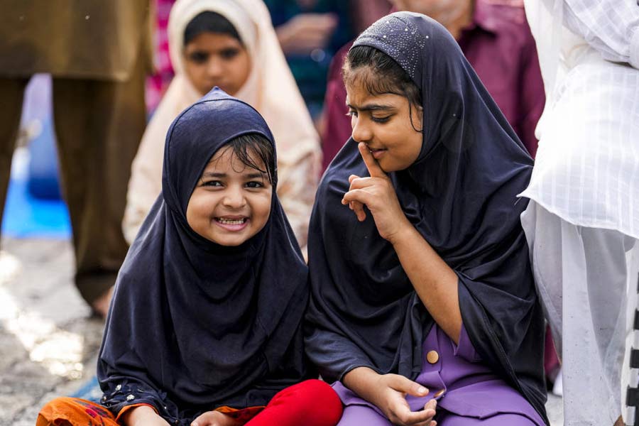 Children offer ‘namaz’ on the occasion of ‘Eid-ul-Azha’ festival outside Bandra station, in Mumbai.