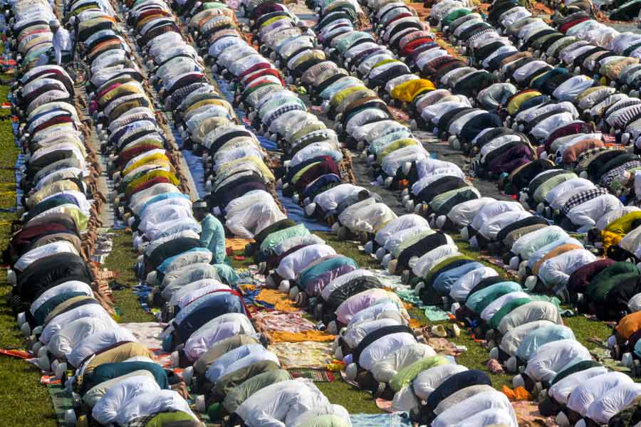 People offer ‘namaz’ on the occasion of ‘Eid-ul-Azha’ festival, at Kanchenjunga Stadium, in Siliguri.