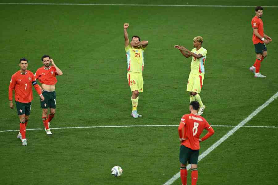 Spain's Mikel Oyarzabal celebrates scoring their second goal with Lamine Yamal