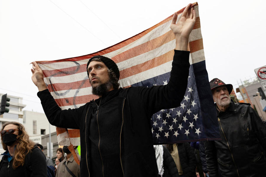 Demonstrators march in the Mission District during a protest against federal immigration sweeps in San Francisco, California, U.S., June 9, 2025. An initial 2,000 Guard troops ordered by Trump started arriving Sunday in Los Angeles, which saw the most violence during three days of protests driven by anger over Trump's stepped-up enforcement of immigration laws that critics say are breaking apart migrant families.