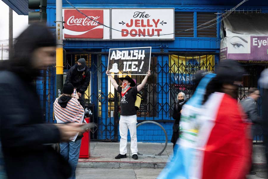 Demonstrators march in the Mission District during a protest against federal immigration sweeps, in San Francisco, California, U.S. California Attorney General Rob Bonta filed a lawsuit over the use of National Guard troops following the first deployment, telling reporters in his announcement Monday that Trump had “trampled” the state's sovereignty.