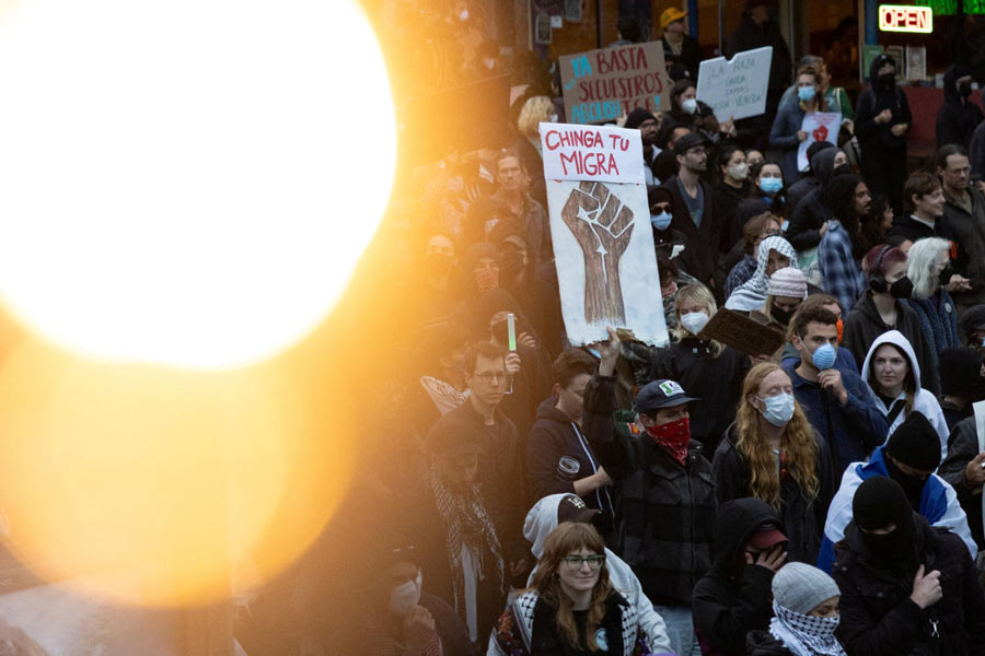 Demonstrators march in the Mission District during a protest against federal immigration sweeps, in San Francisco, California, U.S.