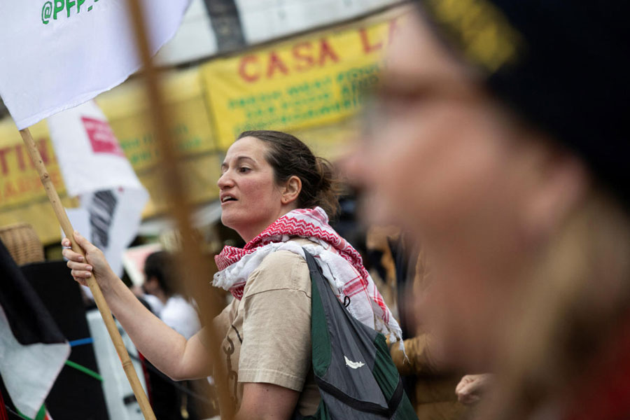 Demonstrators march in the Mission District during a protest against federal immigration sweeps, in San Francisco, California, U.S.