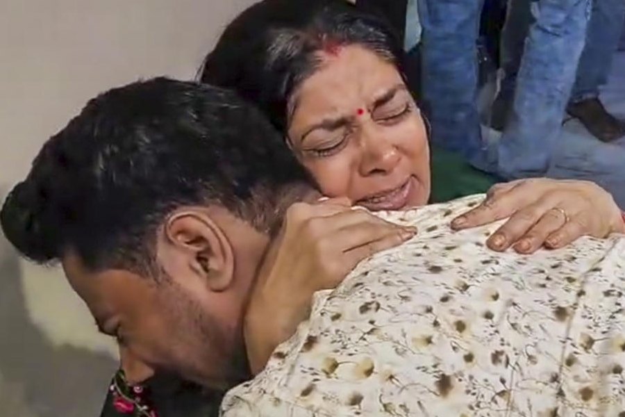 Govind Raghuvanshi, brother of Sonam Raghuvanshi who is among the five arrested for the murder of her husband Raja Raghuvanshi, consoles Raja's mother Uma Raghuvanshi during a visit at the latter's residence, in Indore, Wednesday, June 11, 2025.