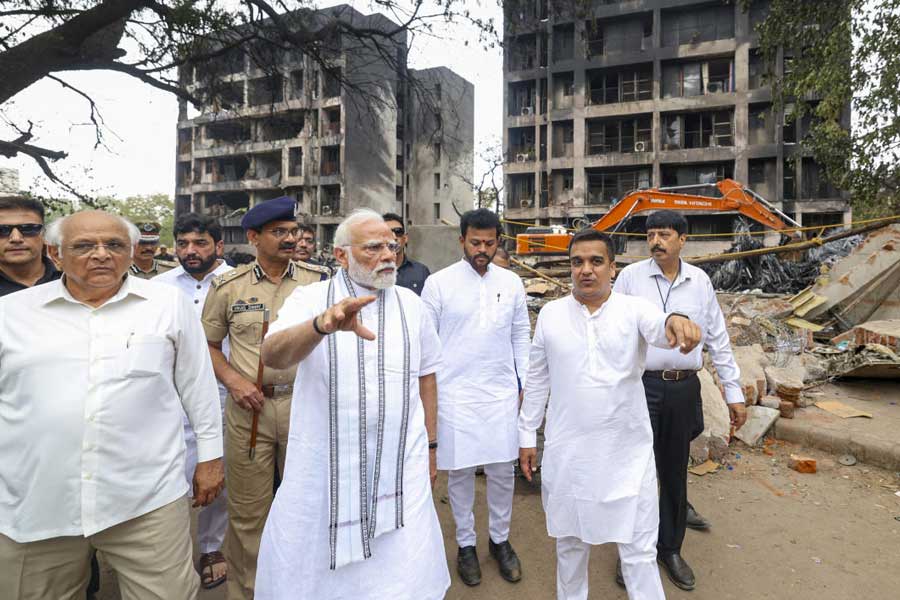 Narendra Modi with Civil Aviation Minister Rammohan Naidu visits the site of the Air India plane crash in Ahmedabad on Friday
