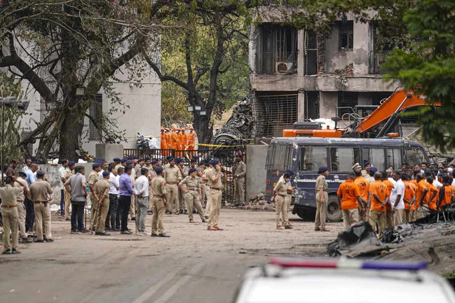 Emergency Services personnel at the site of the Air India plane crash