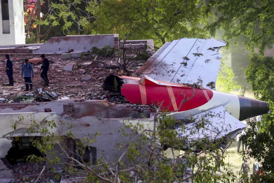 Remains of the Air India plane that crashed moments after taking off from the Ahmedabad airport, lies on a building in Ahmedabad, Thursday, June 12, 2025.