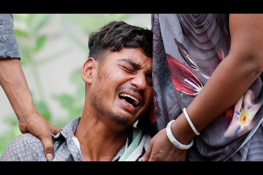 Kalpeshbhai Patni, whose 14-year-old brother Akash died when a flying and burning piece from the plane fell on him as he slept in front of his family’s tea stall near the BJ Medical College hostel into which the aircraft crashed. (Reuters)