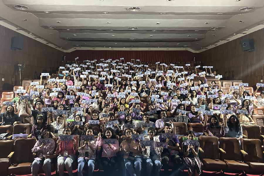 Members of Bengal BTS Armys during a concert screening event at Gyan Manch