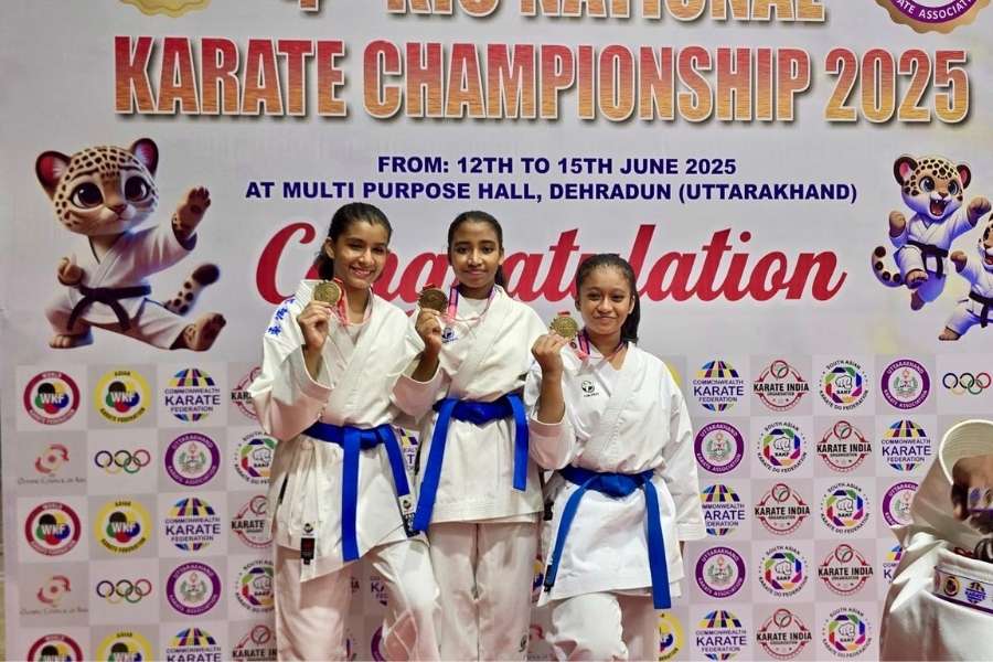 (L-R) Chitralekha Kar, Diya Roy and Bipaasha with their gold medals in the Junior Female Team Kata event