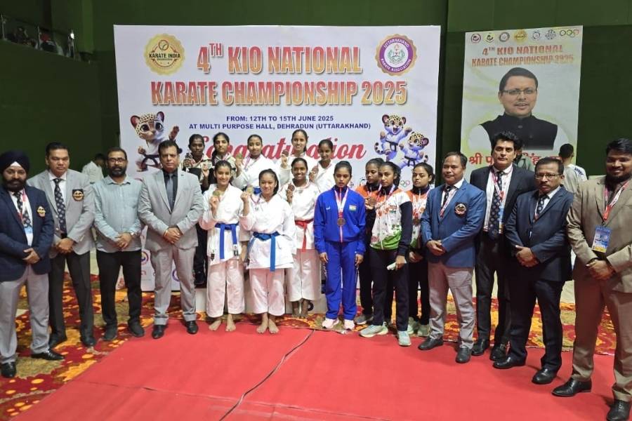 The Bengal Cadet Female Kata team received their medals from the Karate India Organisation president