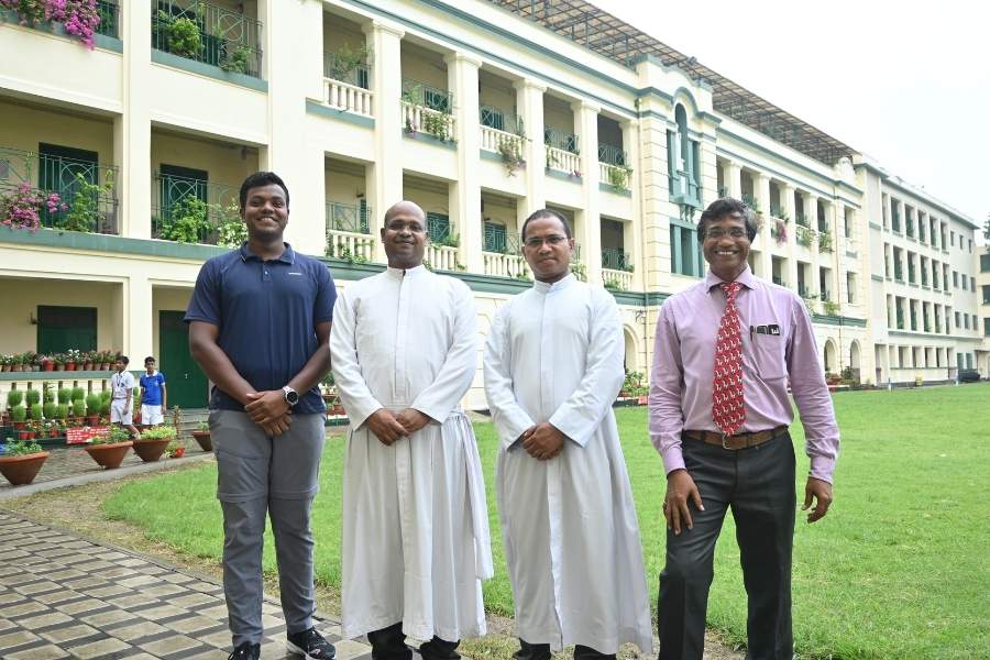 (L-R) SXCS football coach Romario Angelo Topno; principal Rev Fr Roshan Tirkey, SJ; vice principal Fr Narendra Singh, SJ; and house coordinator Farino Torcato