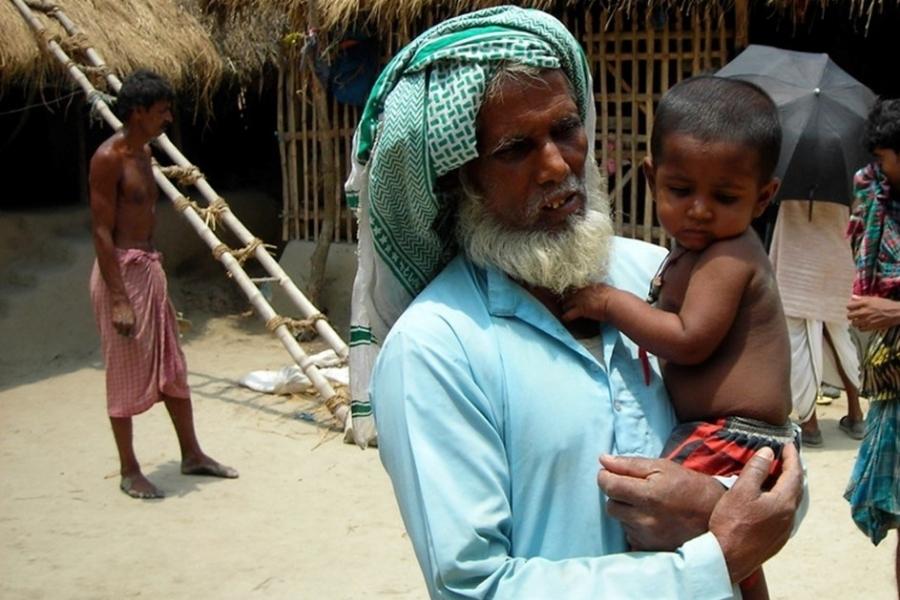 The grandfather in Kultali with his polio-affected grandchild