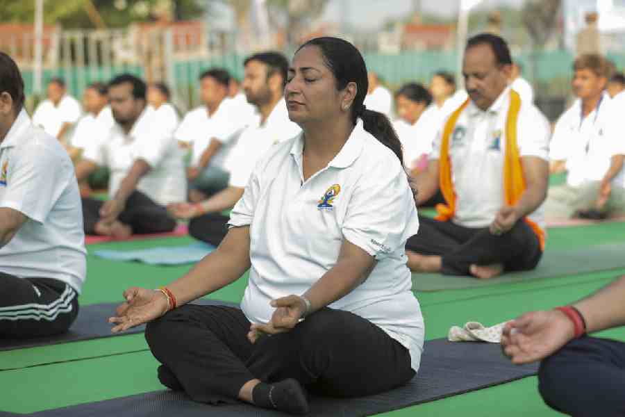 Delhi Chief Minister Rekha Gupta takes part in a yoga session on the International Day of Yoga, in New Delhi.