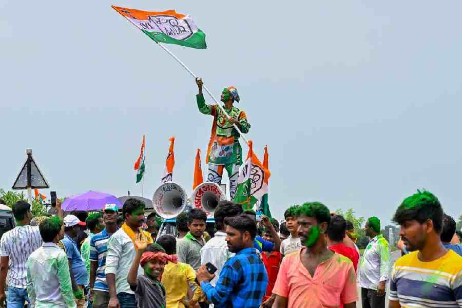 Trinamool Congress supporters celebrate the victory in the Kaliganj by-election on Monday.