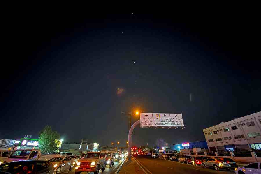 Traces are seen in the sky after Iran's armed forces say they targeted The Al-Udeid base in a missile attack, as seen from Doha, Qatar.