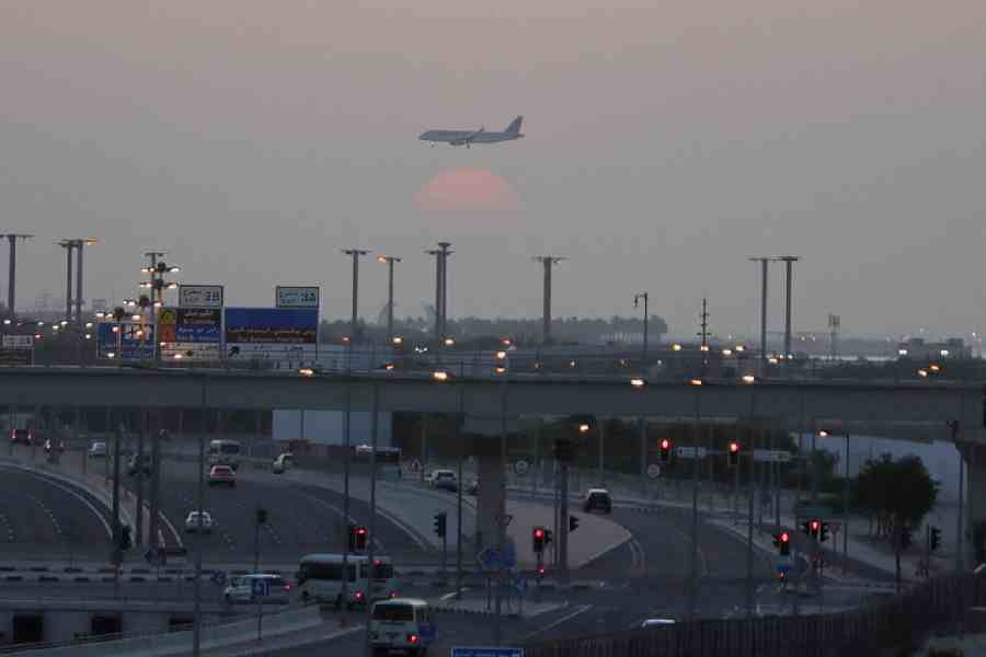 A passenger plane flies during sunrise as seen from Al Thumama, after Qatar reopened its airspace after a brief suspension, following Monday's missile attack on Al Udeid Air Base by Iran.