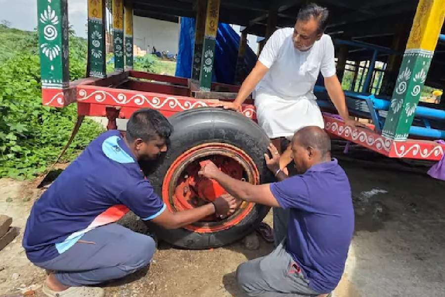 Workers fit the Sukhoi tyres manufactured by MRF