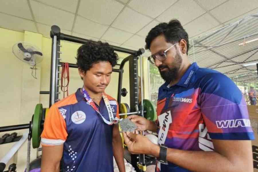 Rahul Banerjee checks out the Archery Asia Cup silver medal won by his student Juyal Sarkar