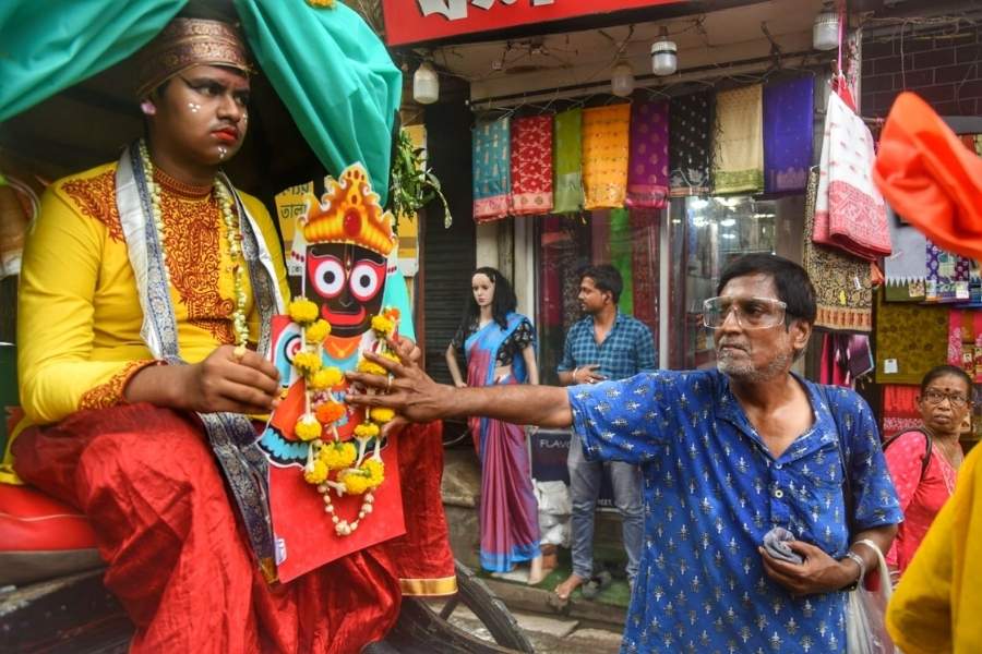 Specially-abled children take part in a vibrant Rath Yatra celebration in Shyambazar, riding hand-pulled rickshaws adorned with decorations and Lord Jagannath’s image