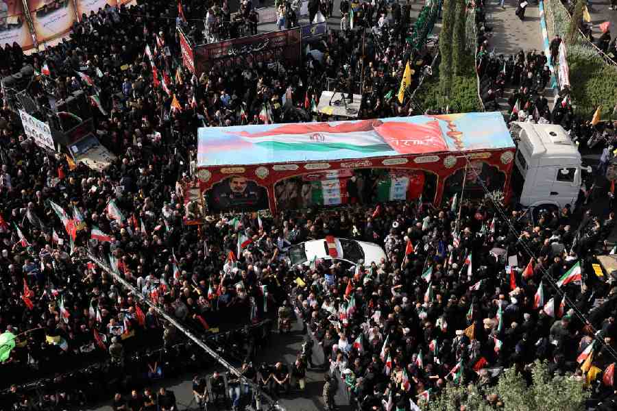 People attend the funeral procession of Iranian military commanders and nuclear scientists killed in Israeli strikes, in Tehran, Iran.