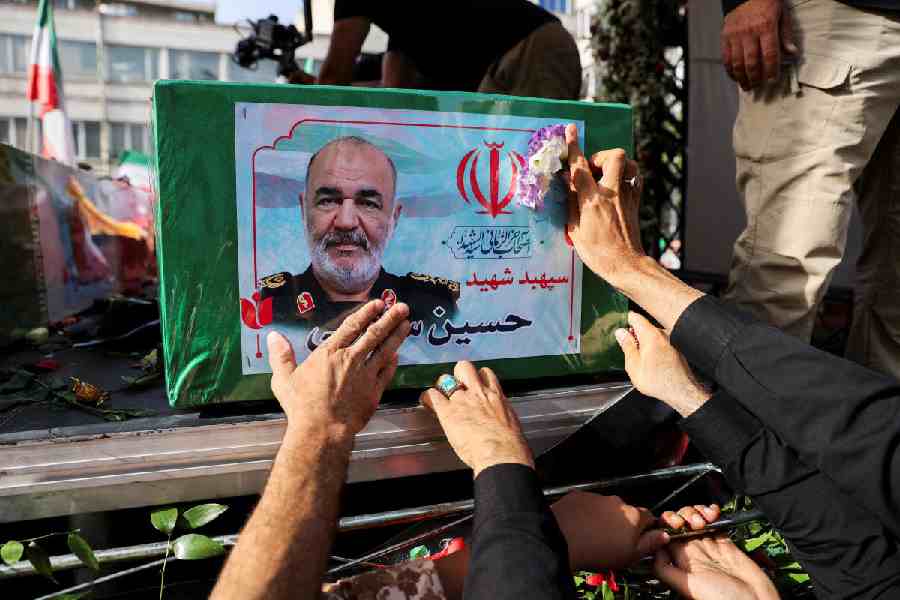 People attend the funeral procession of Iranian military commanders and nuclear scientists killed in Israeli strikes, in Tehran, Iran.