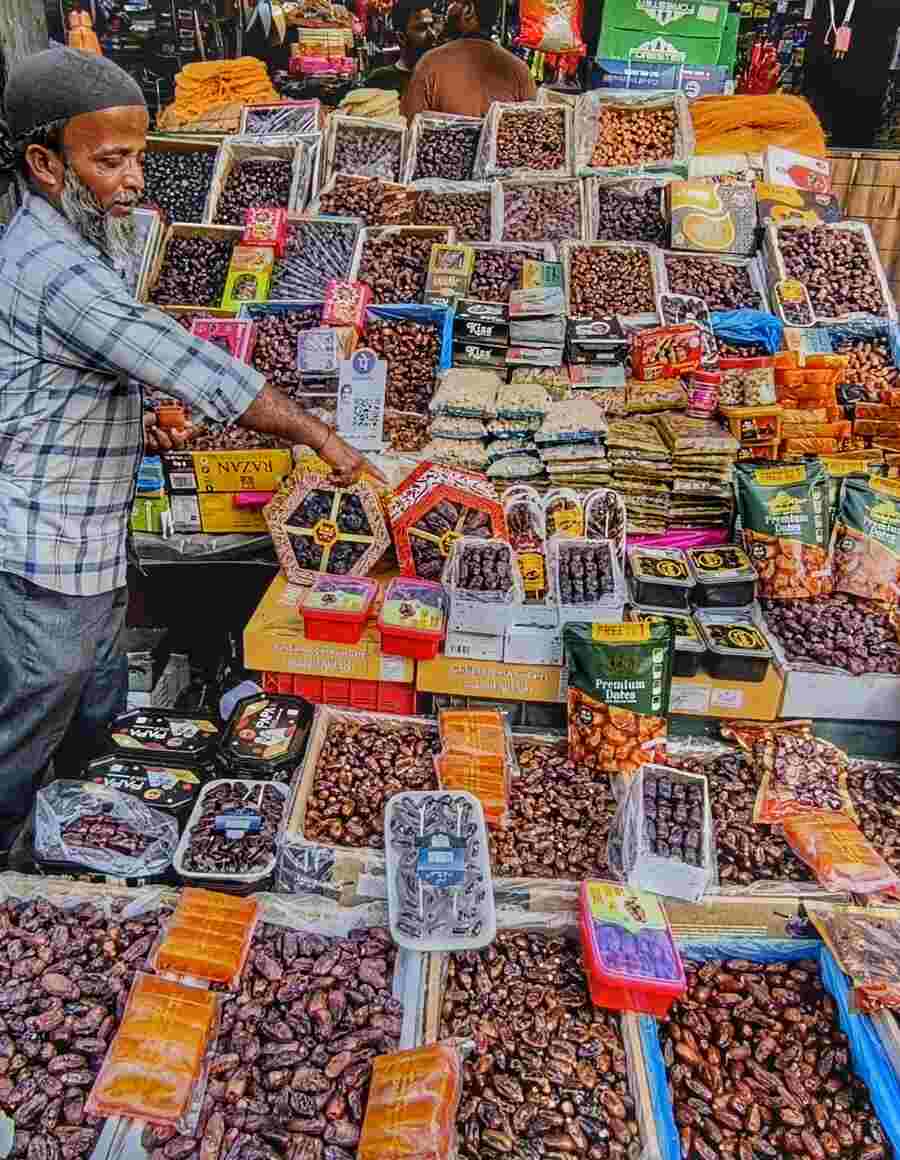 As Ramadan begins, sellers sell a variety of imported dry fruits at Zakaria Street on Sunday 